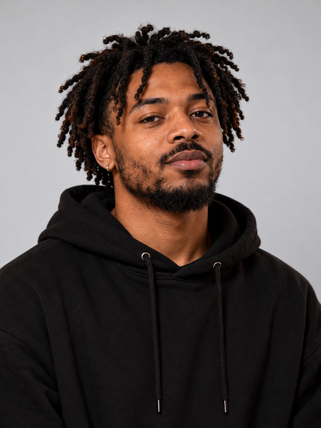 AI-created fictional adult A in a black hoodie, a single-person portrait example
