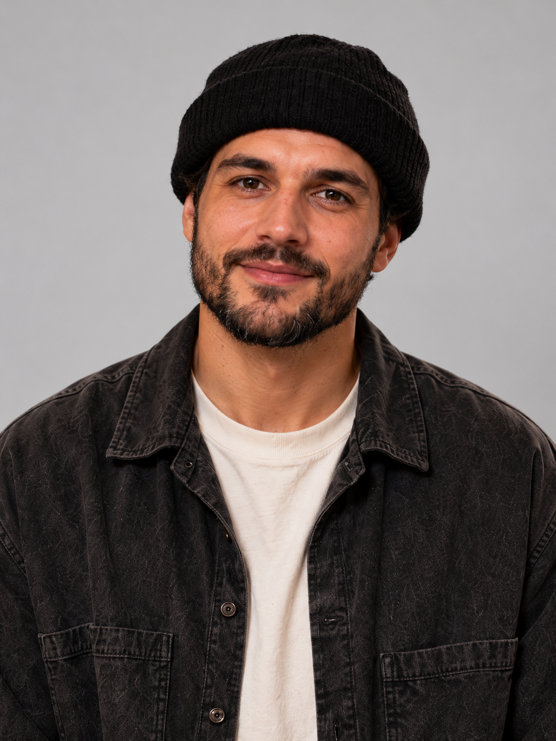 AI-created fictional adult B wearing a beanie, a single-person portrait example